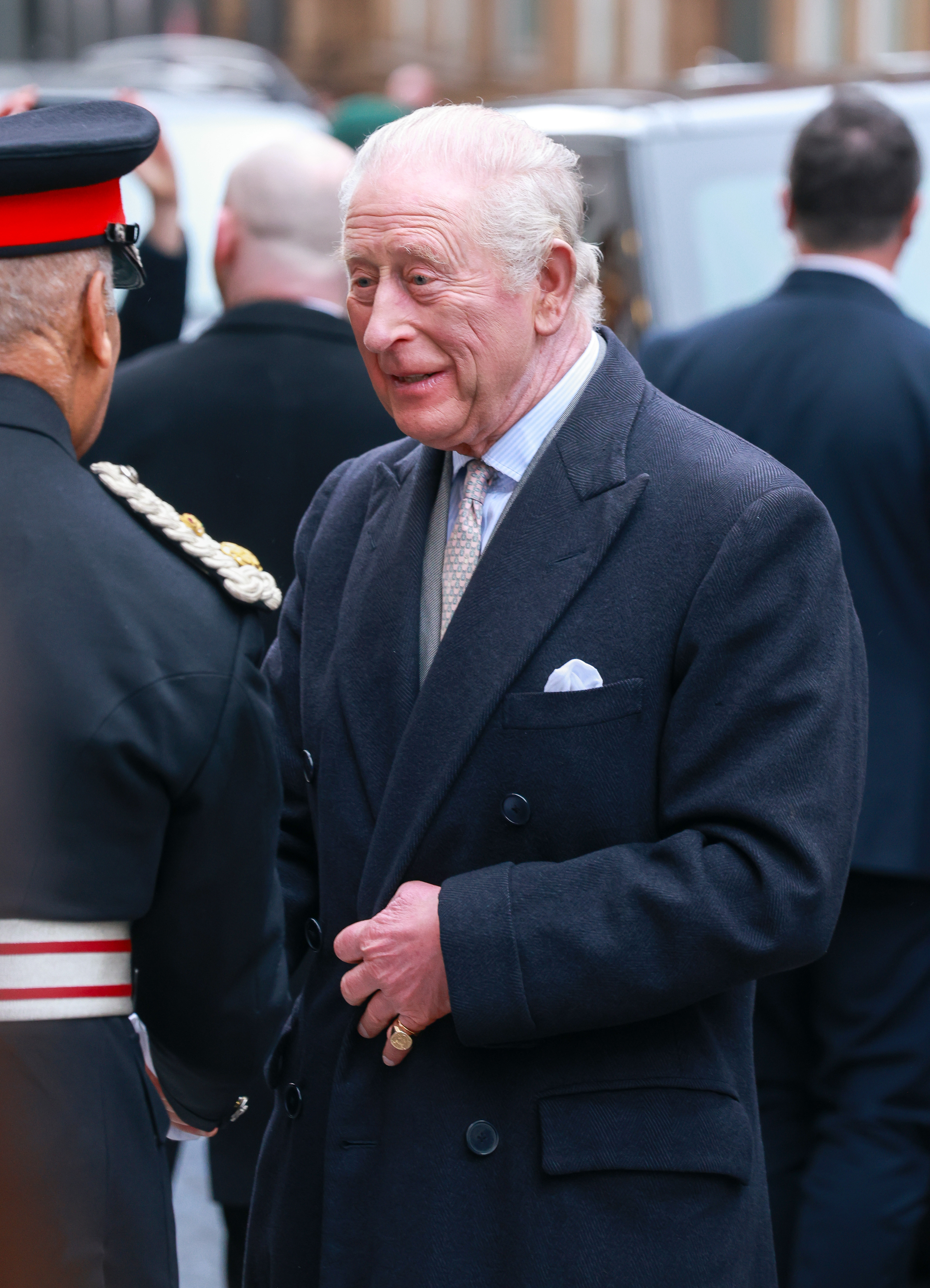 King Charles wearing a dark blue suit jacket with a neutral expression when pictured last week at London Fashion Week
