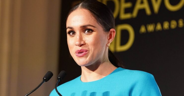 Meghan Markle talking into a microphone