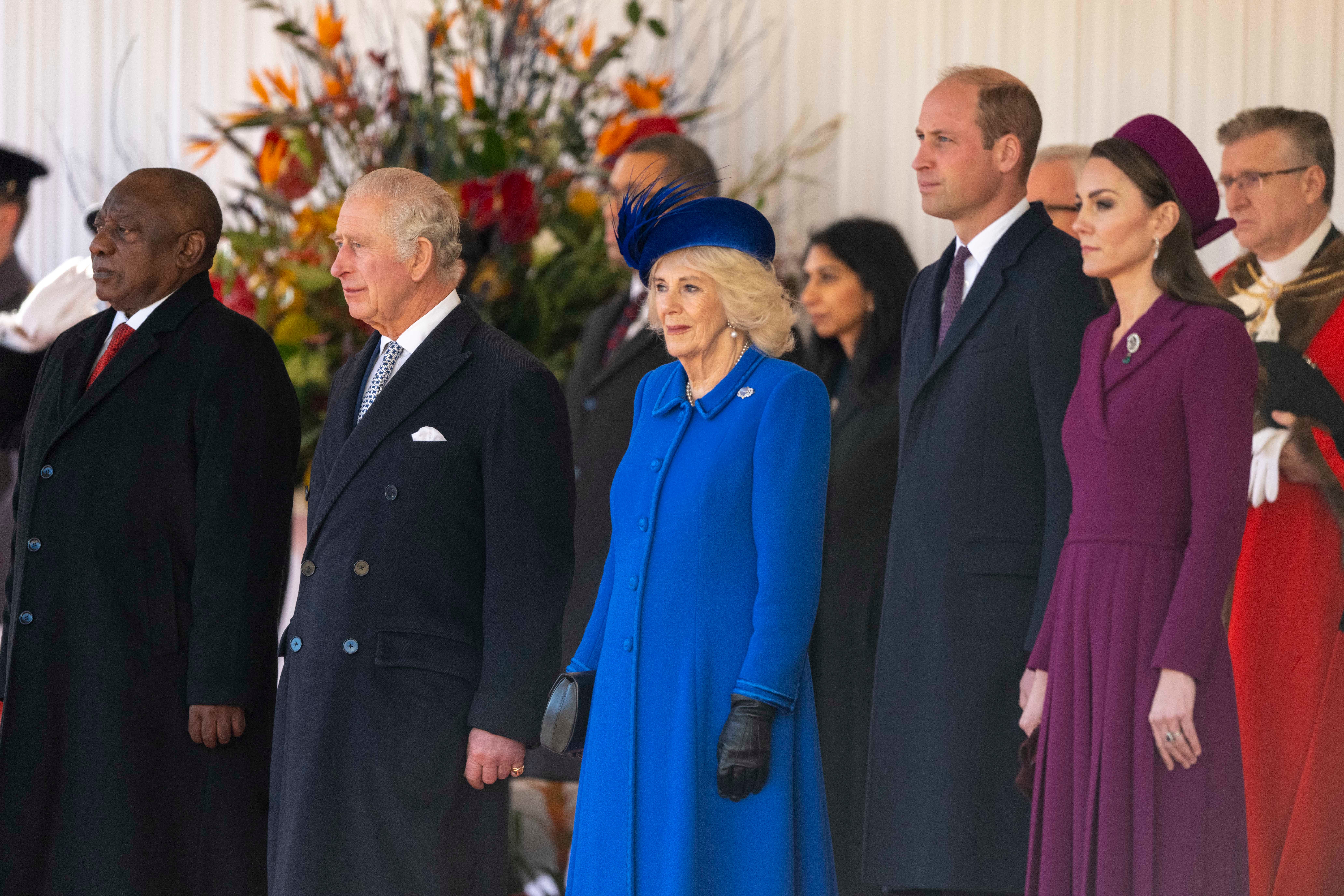 King Charles, Queen Camilla, Prince William and Princess Kate stood in a line