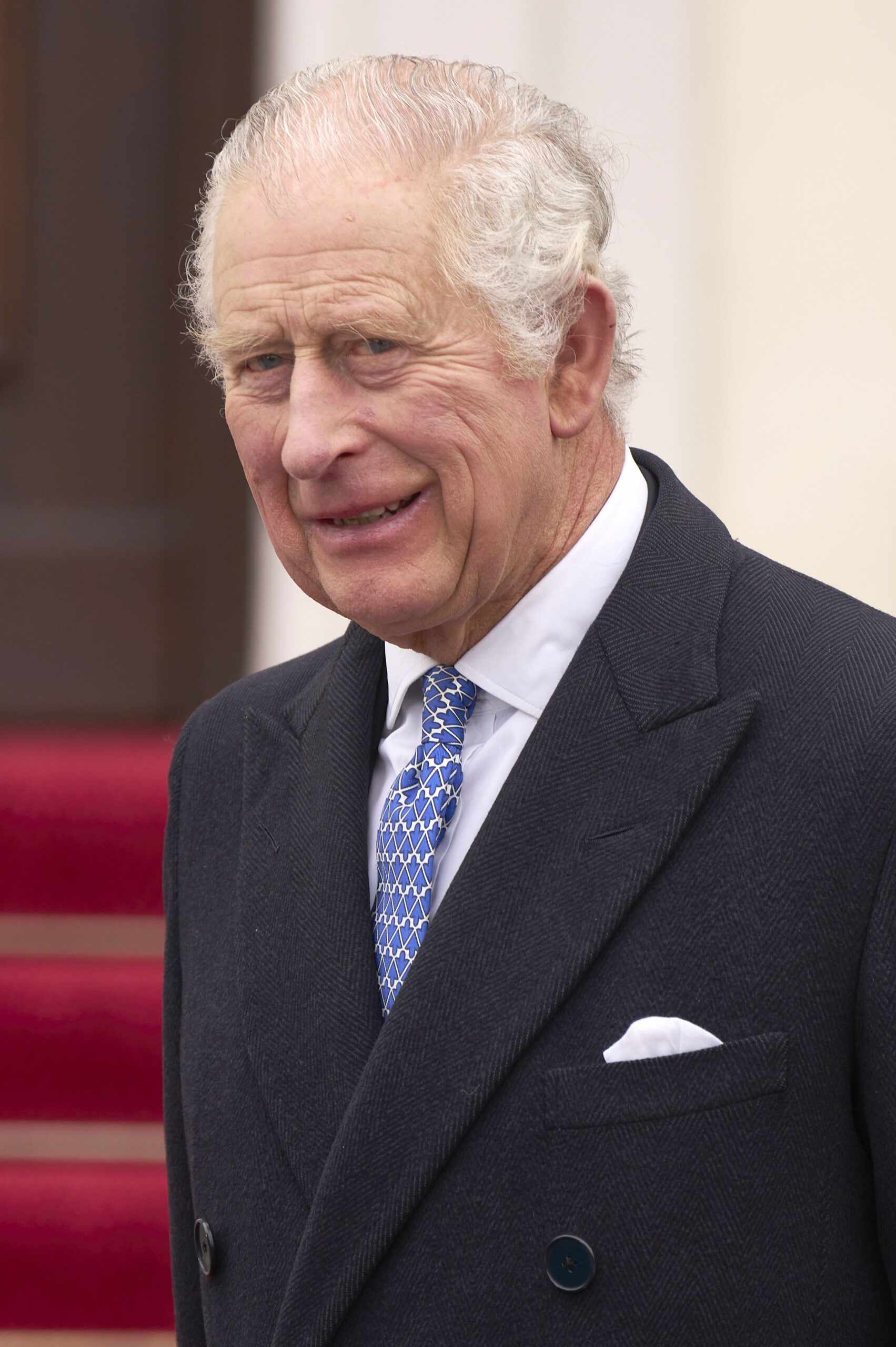 King Charles with an awkward smile