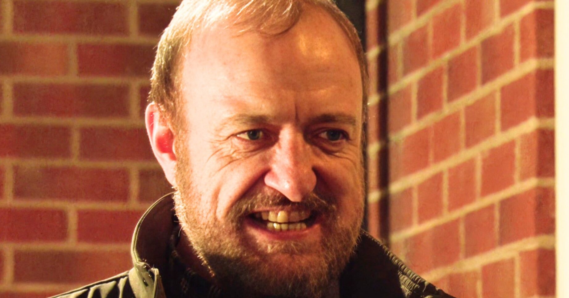 Coronation Street's Mal grimacing