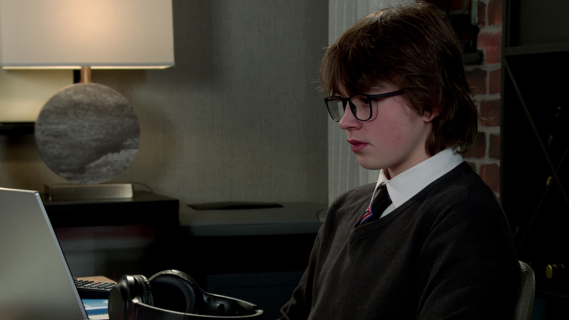 Sam staring at laptop in Coronation Street