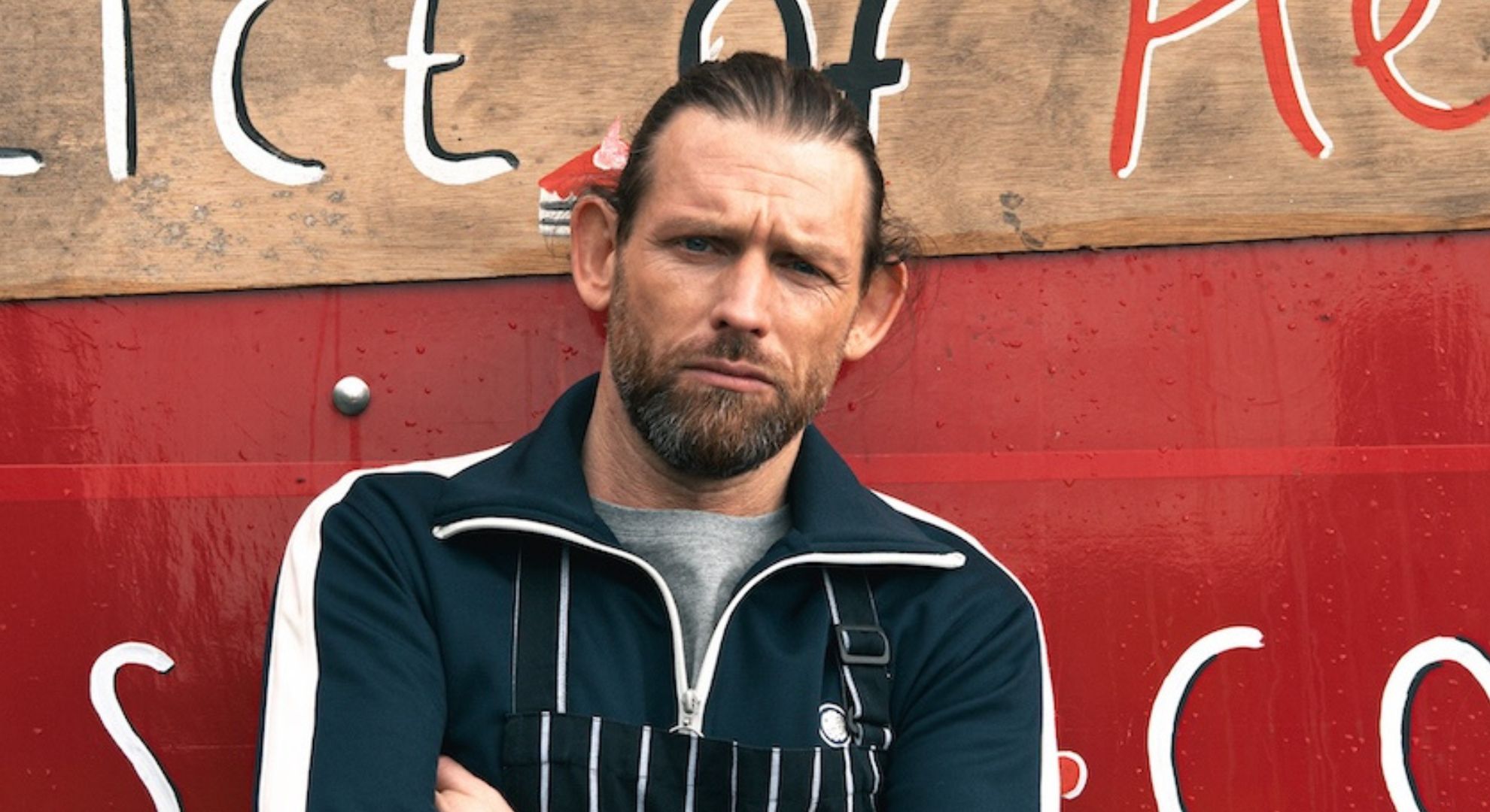 Kev posing at his new business venture in Emmerdale