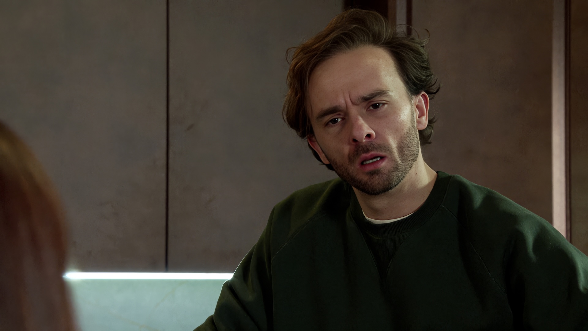 David and Jodie talking with confusion in Coronation Street