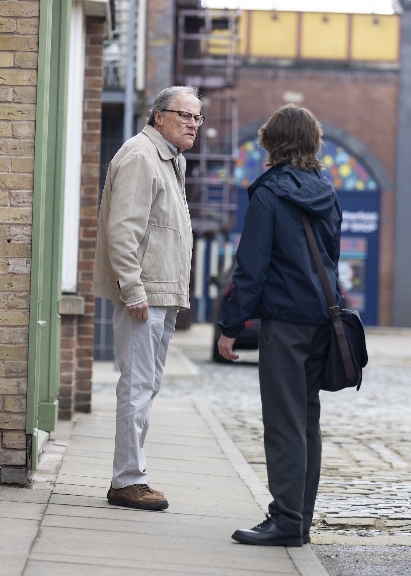 Roy and Sam talking on the Street