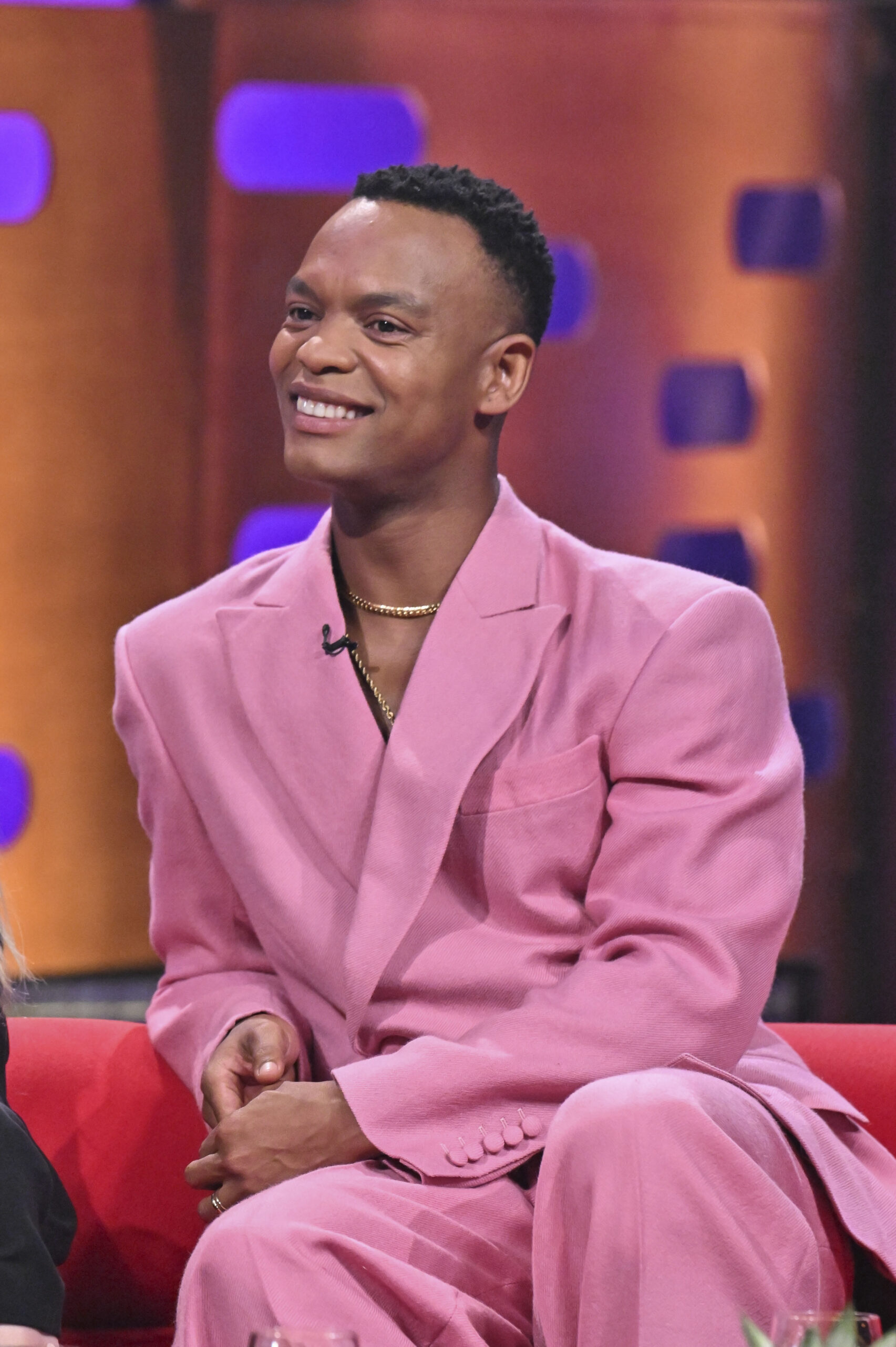 Johannes Radebe in a pink suit