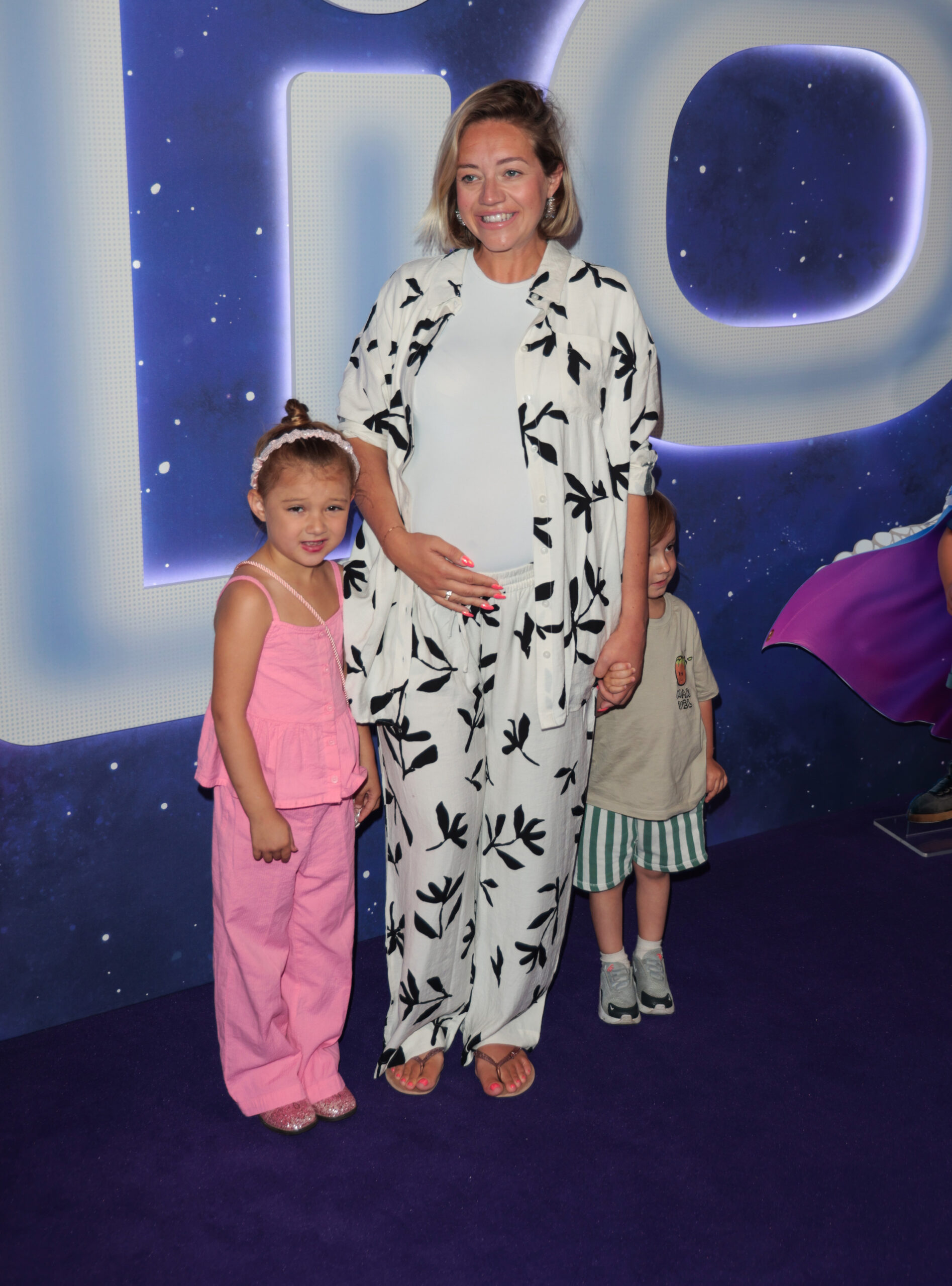 Kelsey Parker smiling and with Aurelia and Bodhi