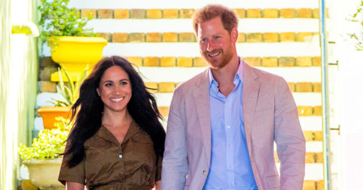 Meghan Markle and Prince Harry walking hand in hand