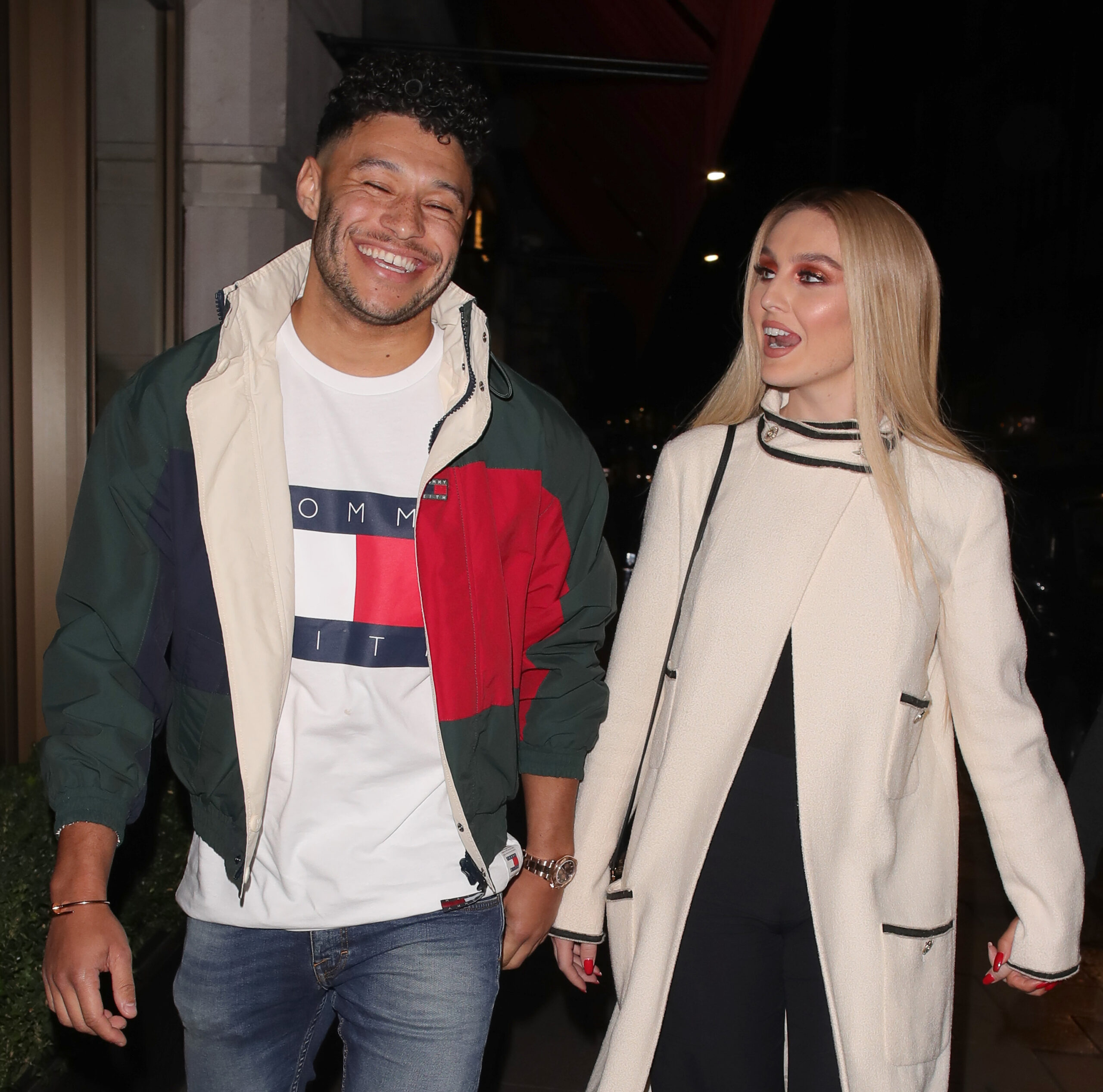 Perrie Edwards and Alex Oxlade-Chamberlain smiling