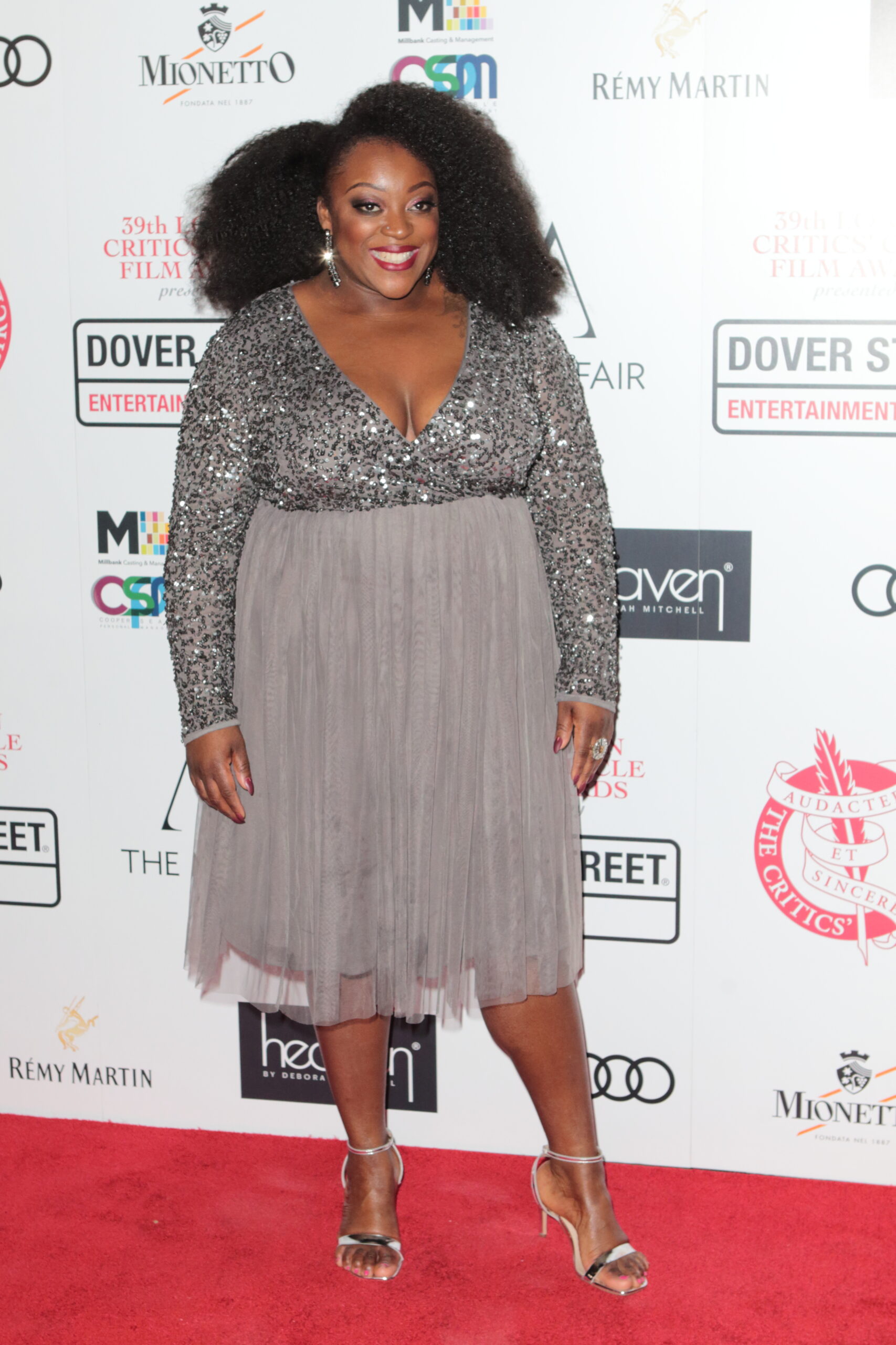 Judi Love posing