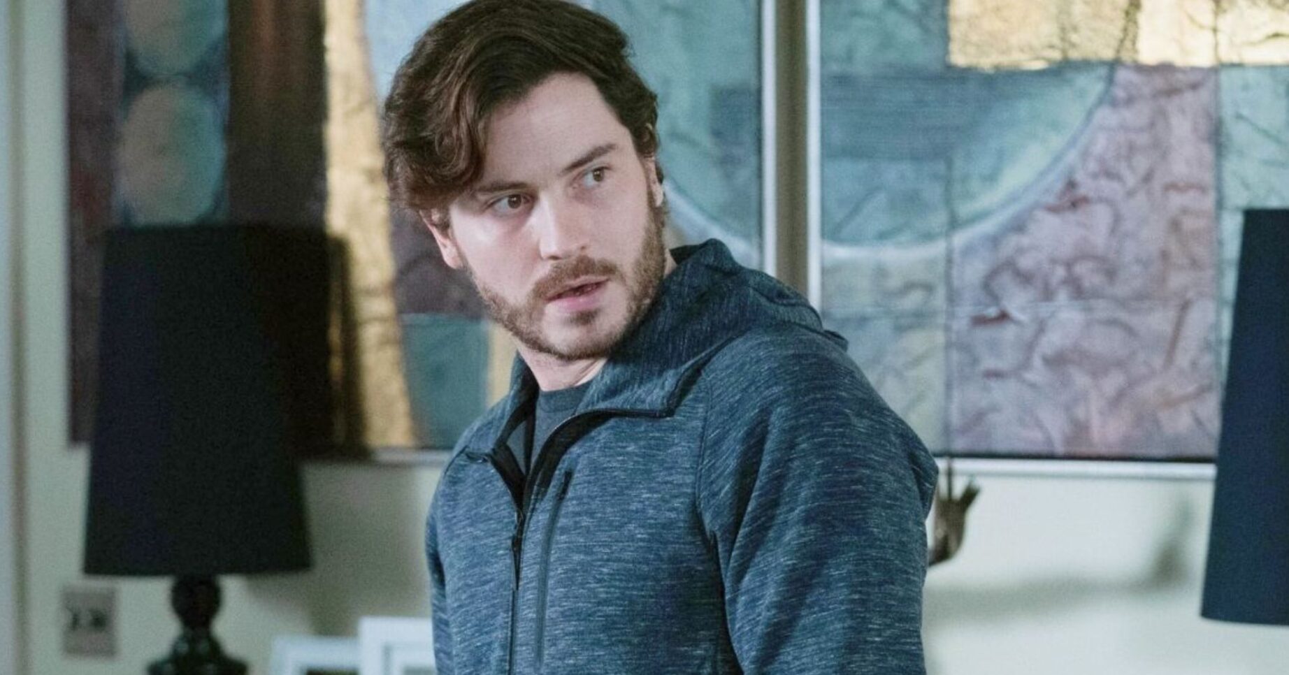 Gray looking shifty in a grey hoodie