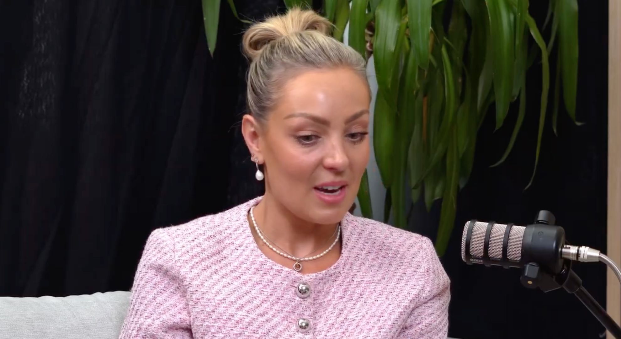 Amy Dowden on a podcast looking down