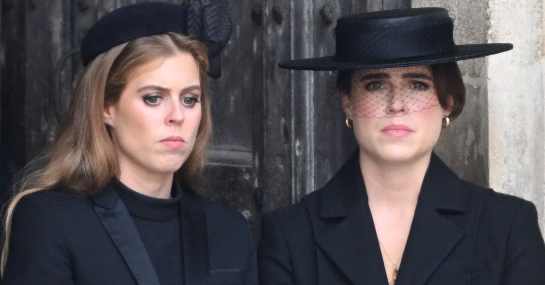 Princess Beatrice and Princess Eugenie frowning at the State Funeral of Queen Elizabeth II