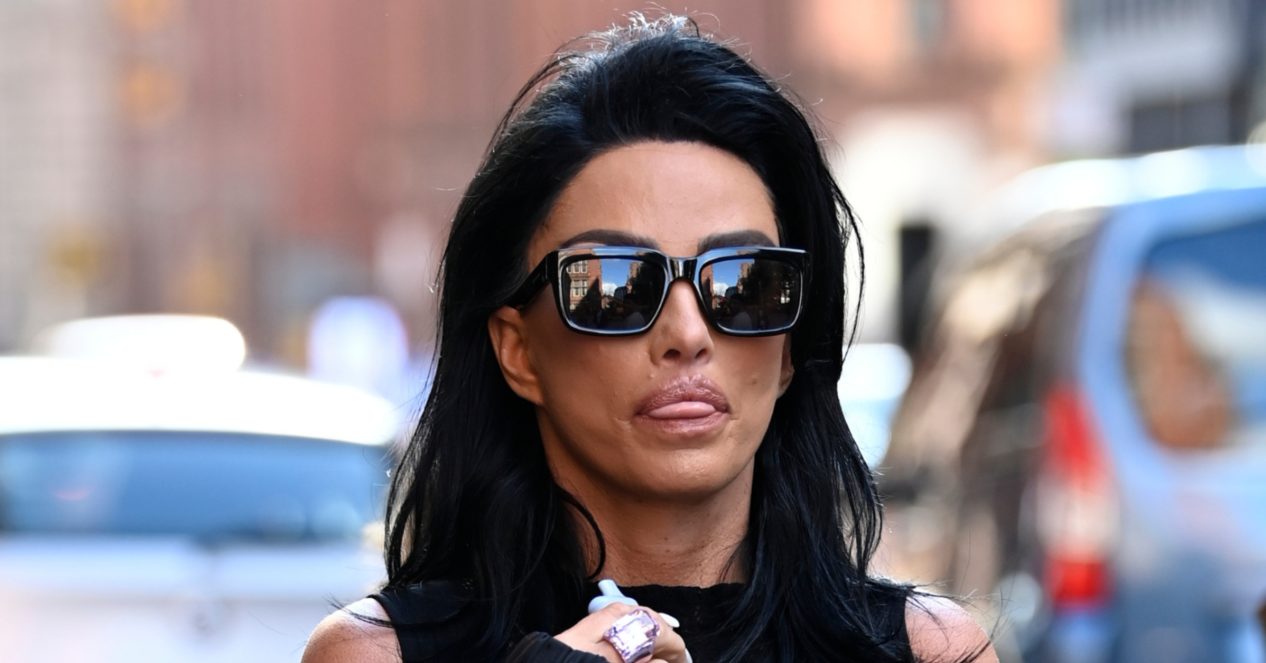 Katie Price wearing sunglasses in the street