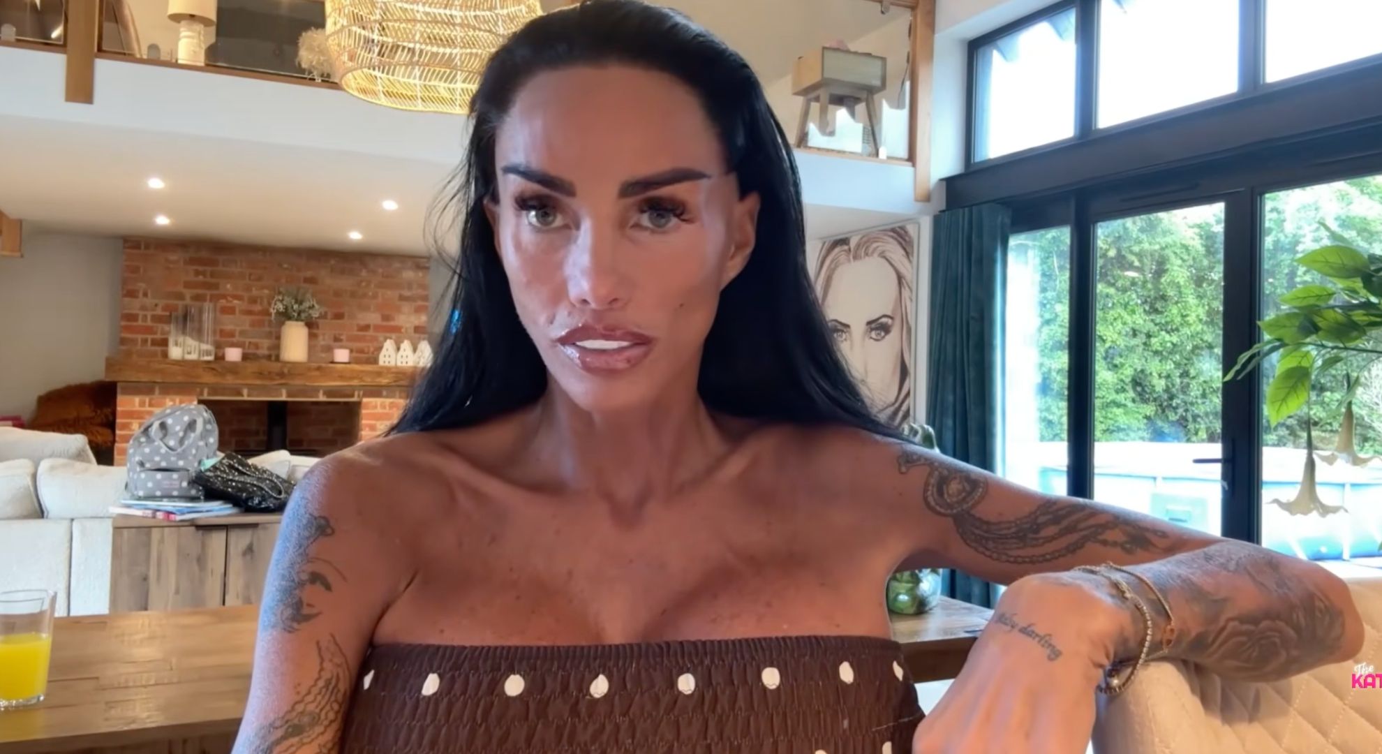 Katie Price in brown strapless top