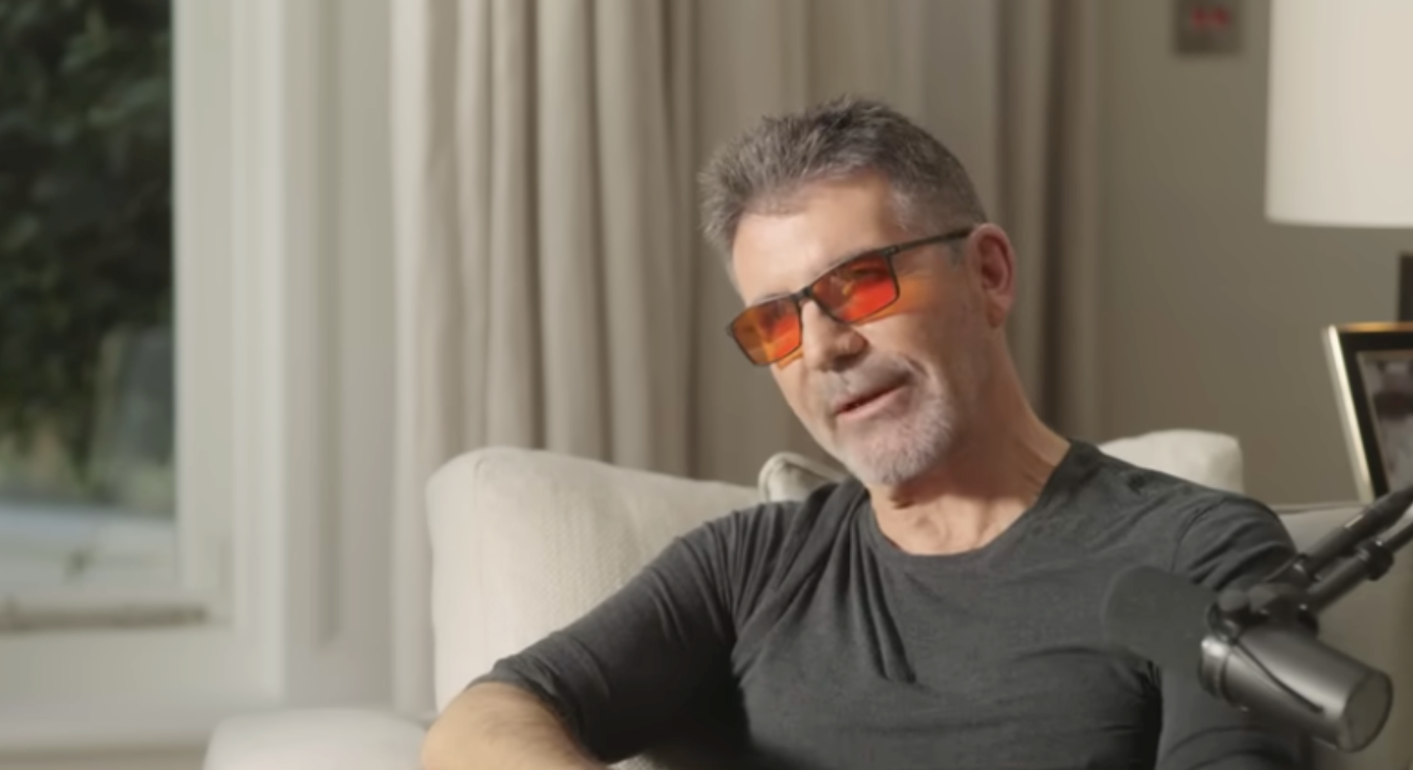 Simon Cowell on a sofa