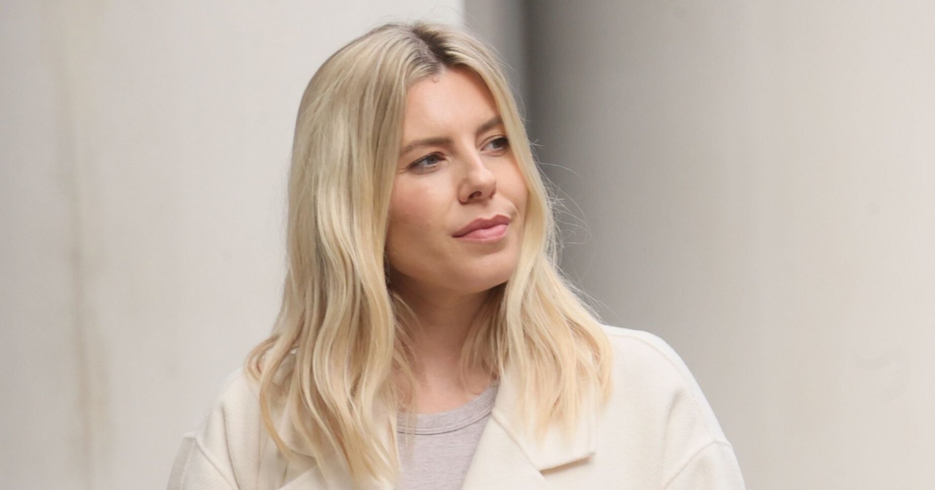 Mollie King looking to the side
