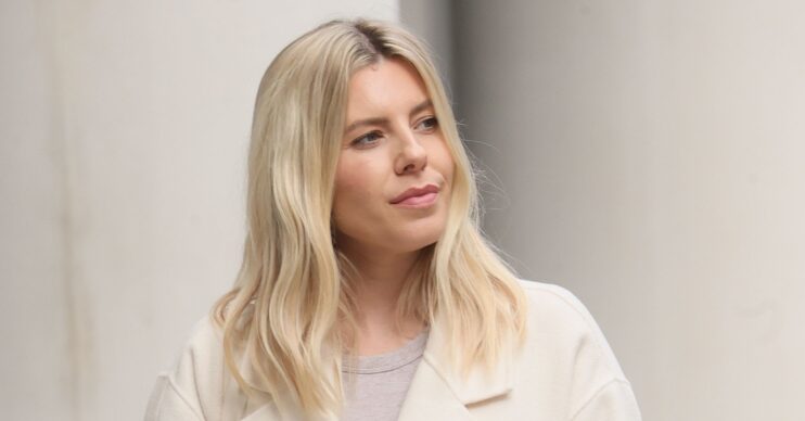 Mollie King looking to the side