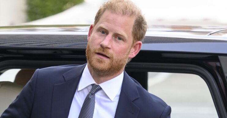 Prince Harry getting out of car in suit