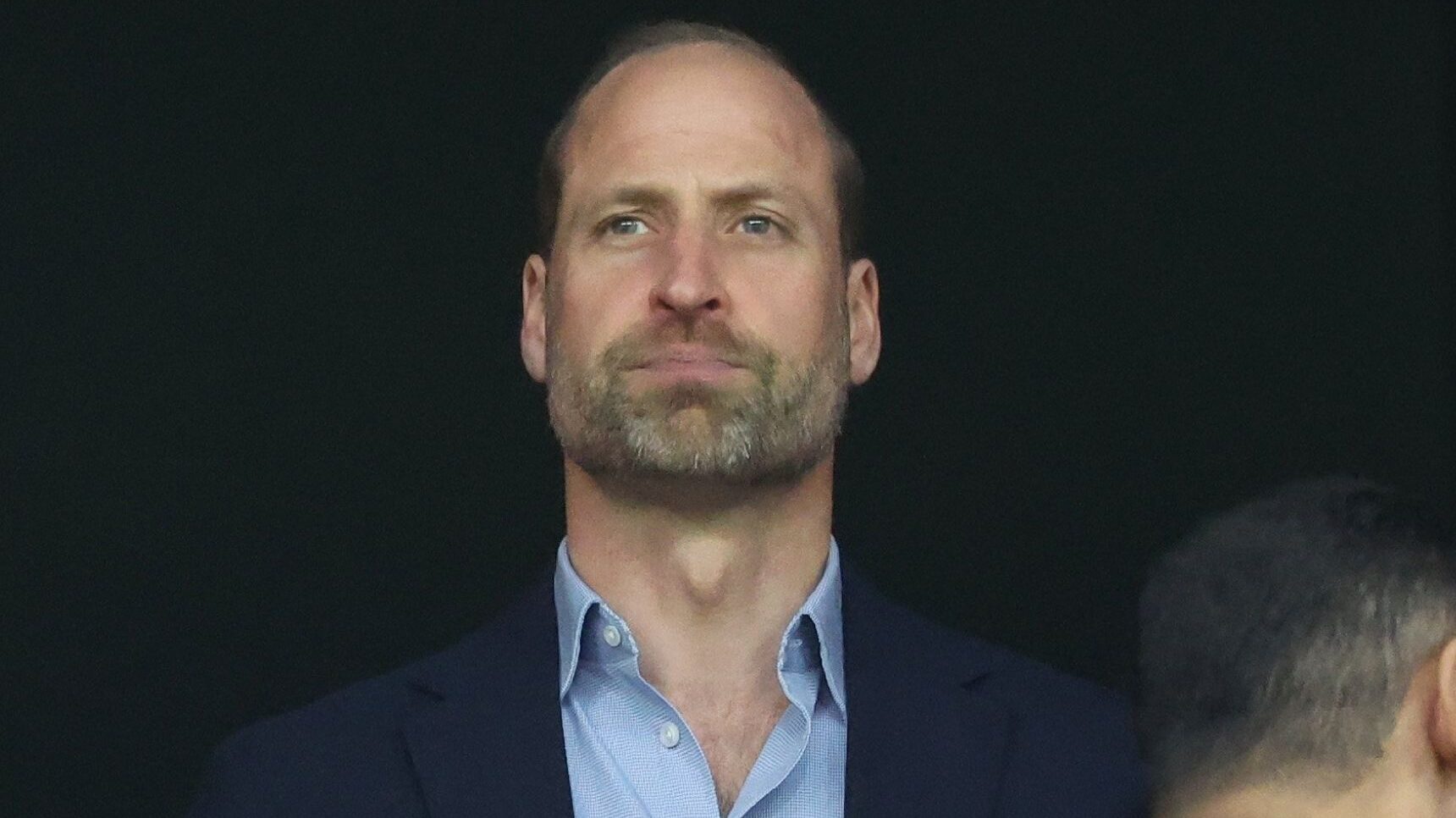Prince William looks serious at Aston Villa football game