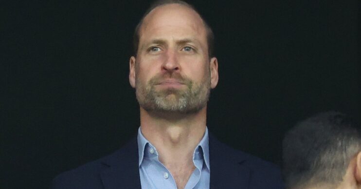Prince William looks serious at Aston Villa football game