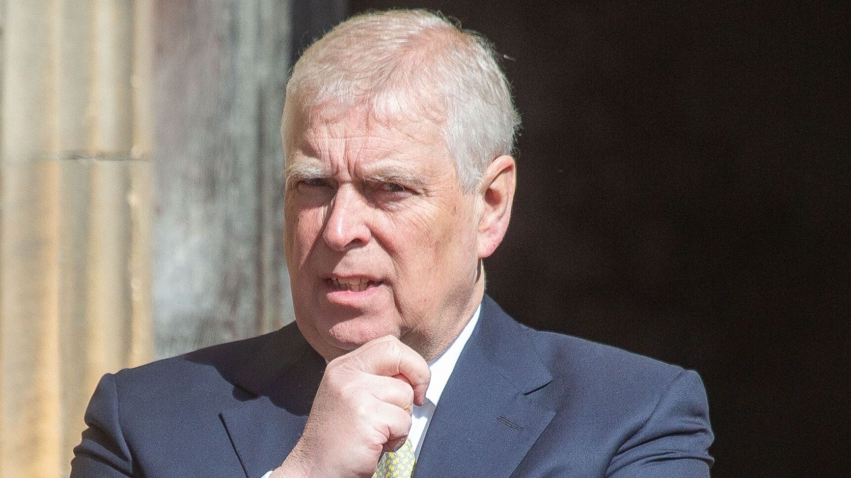 Andrew Mountbatten-Windsor resting his hand on his chin