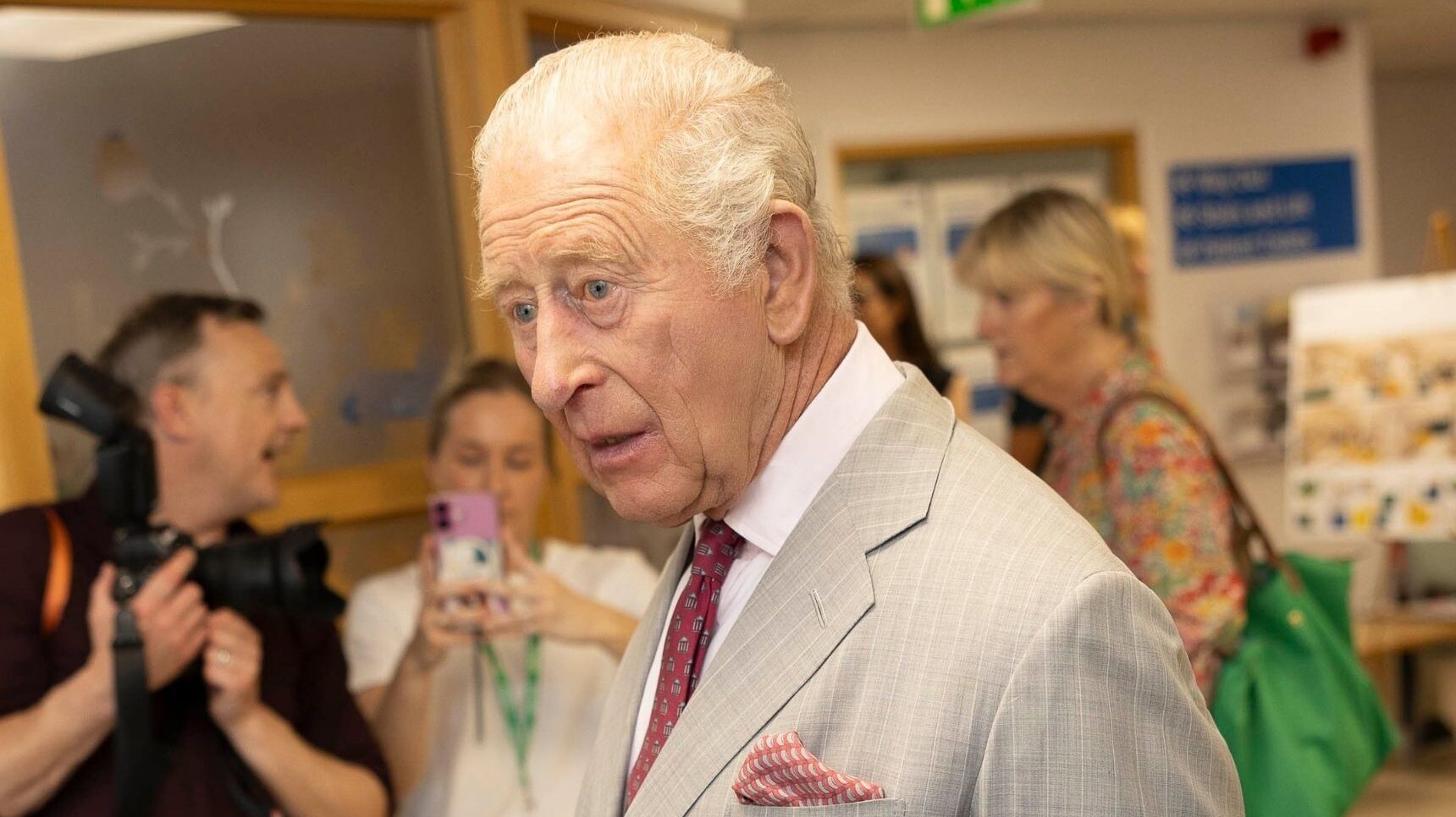 King Charles speaking to staff at hospital