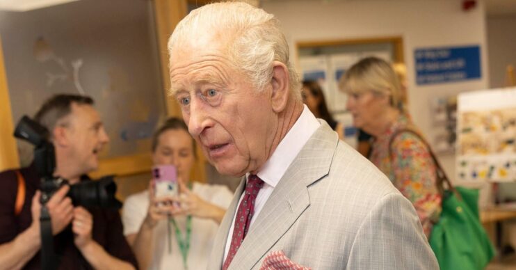 King Charles speaking to staff at hospital
