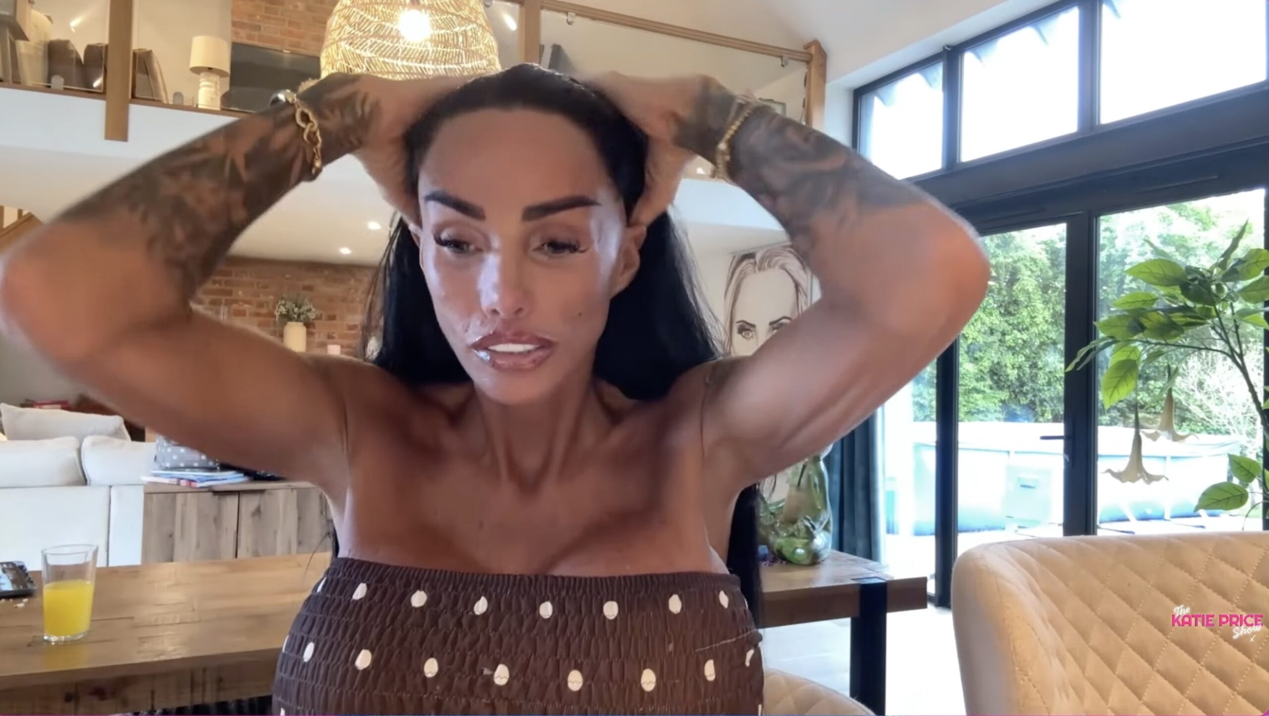 Katie Price holding her hair back