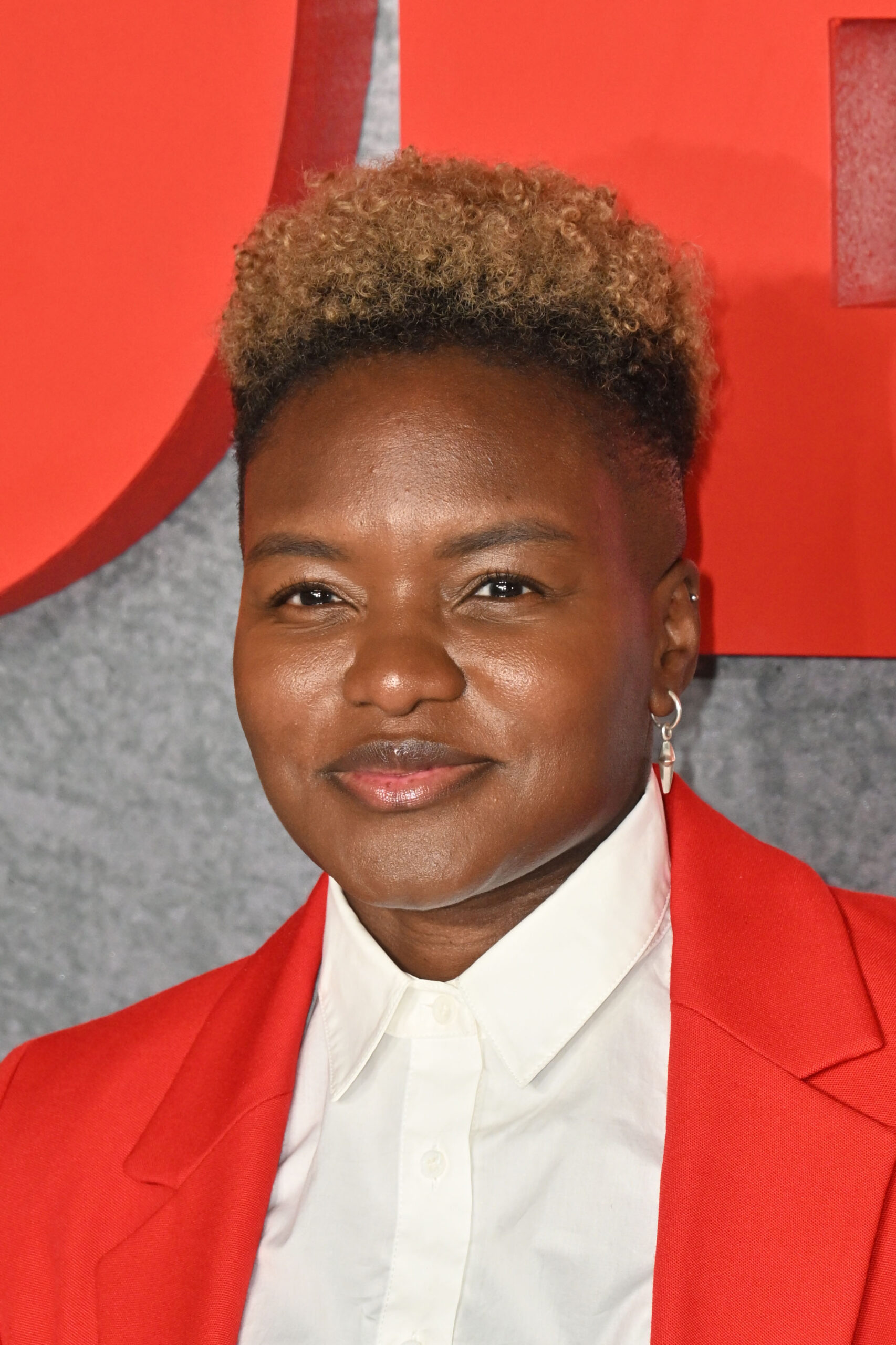 Nicola Adams in a red suit 