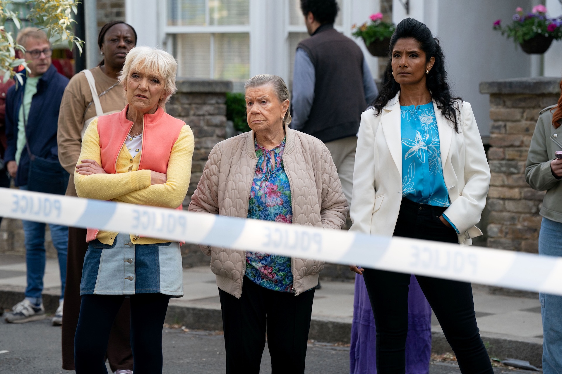 Jean, Mo and Suki next to police tape in EastEnders