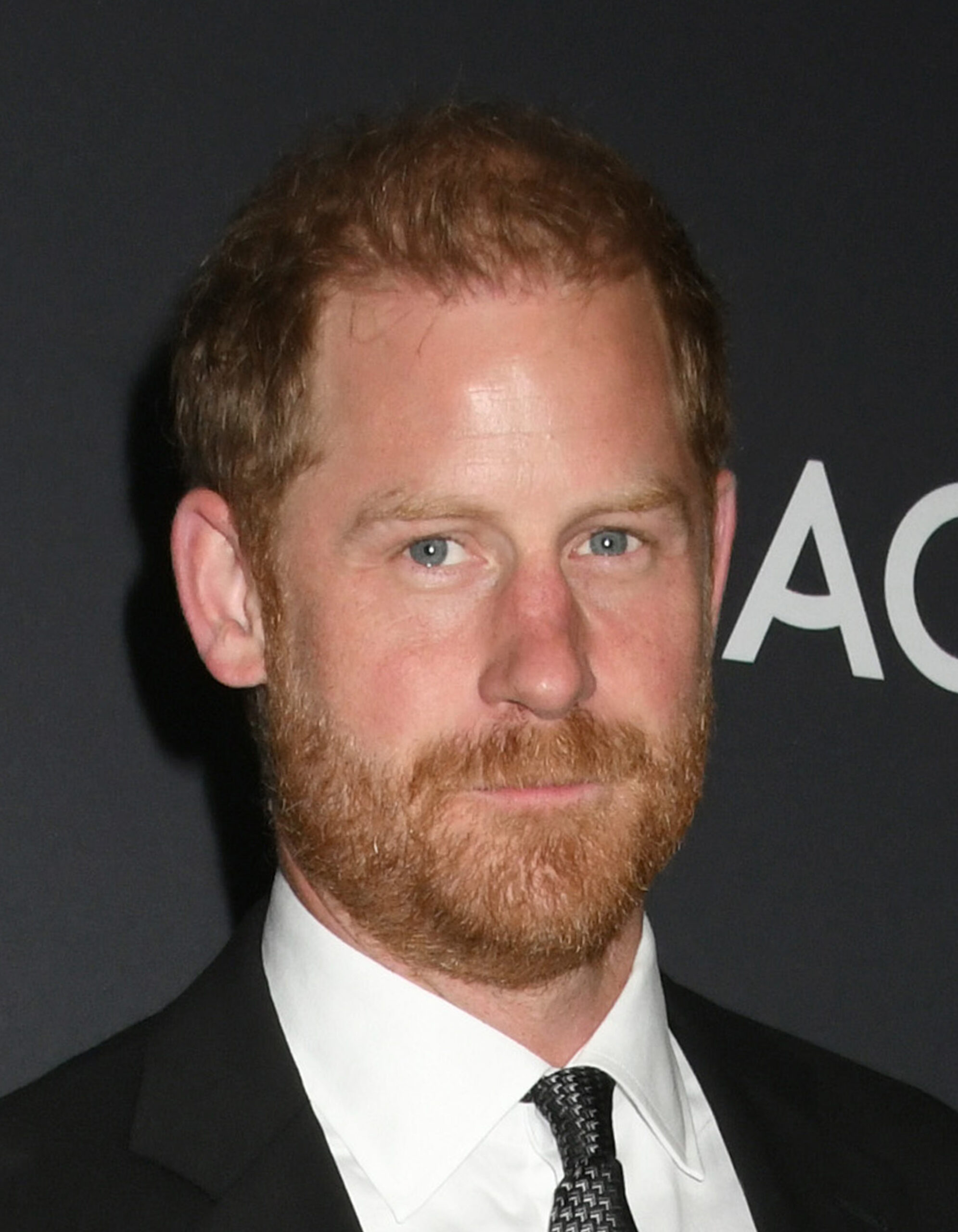 Prince Harry with a small smile on his face