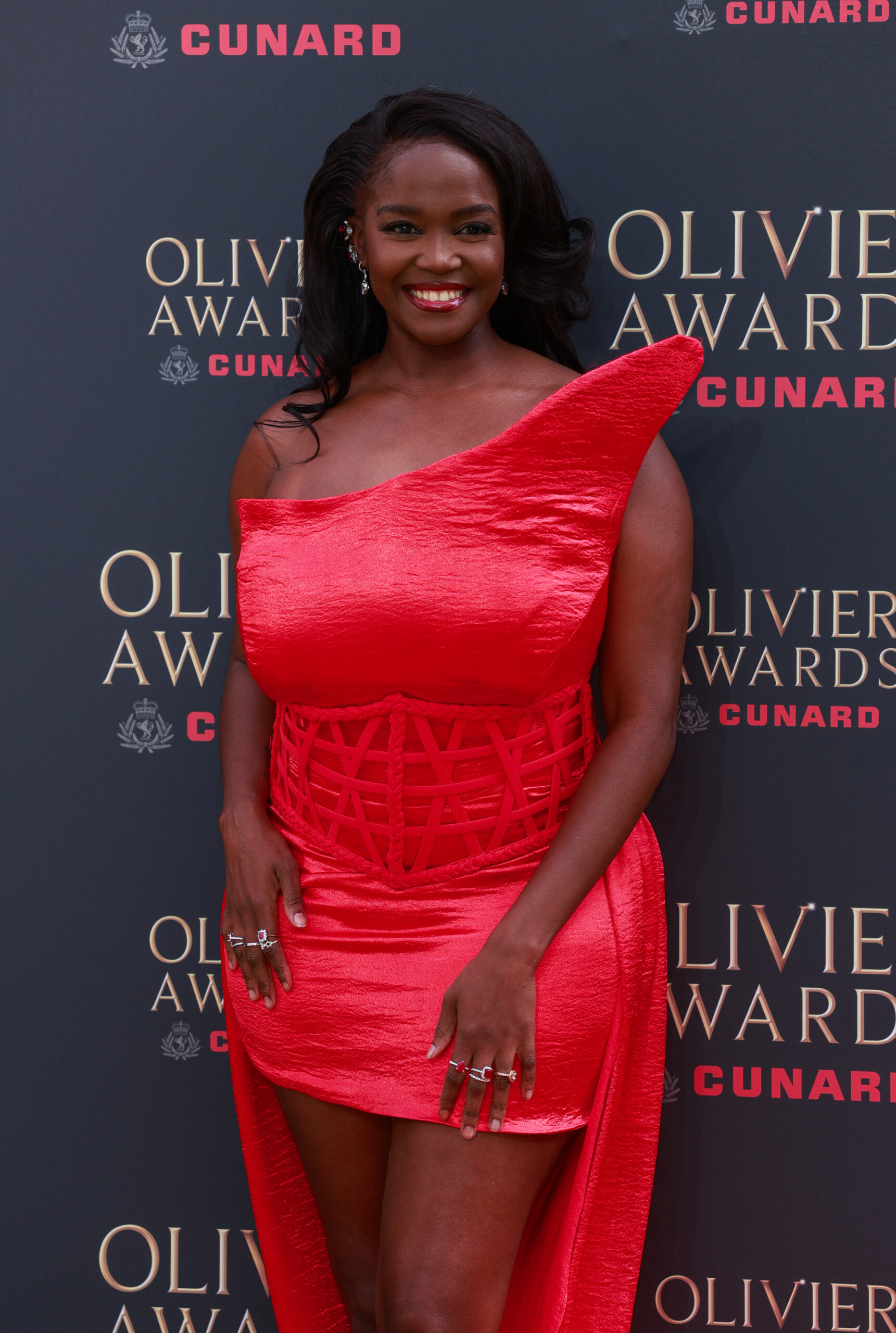 Oti Mabuse in red dress at event