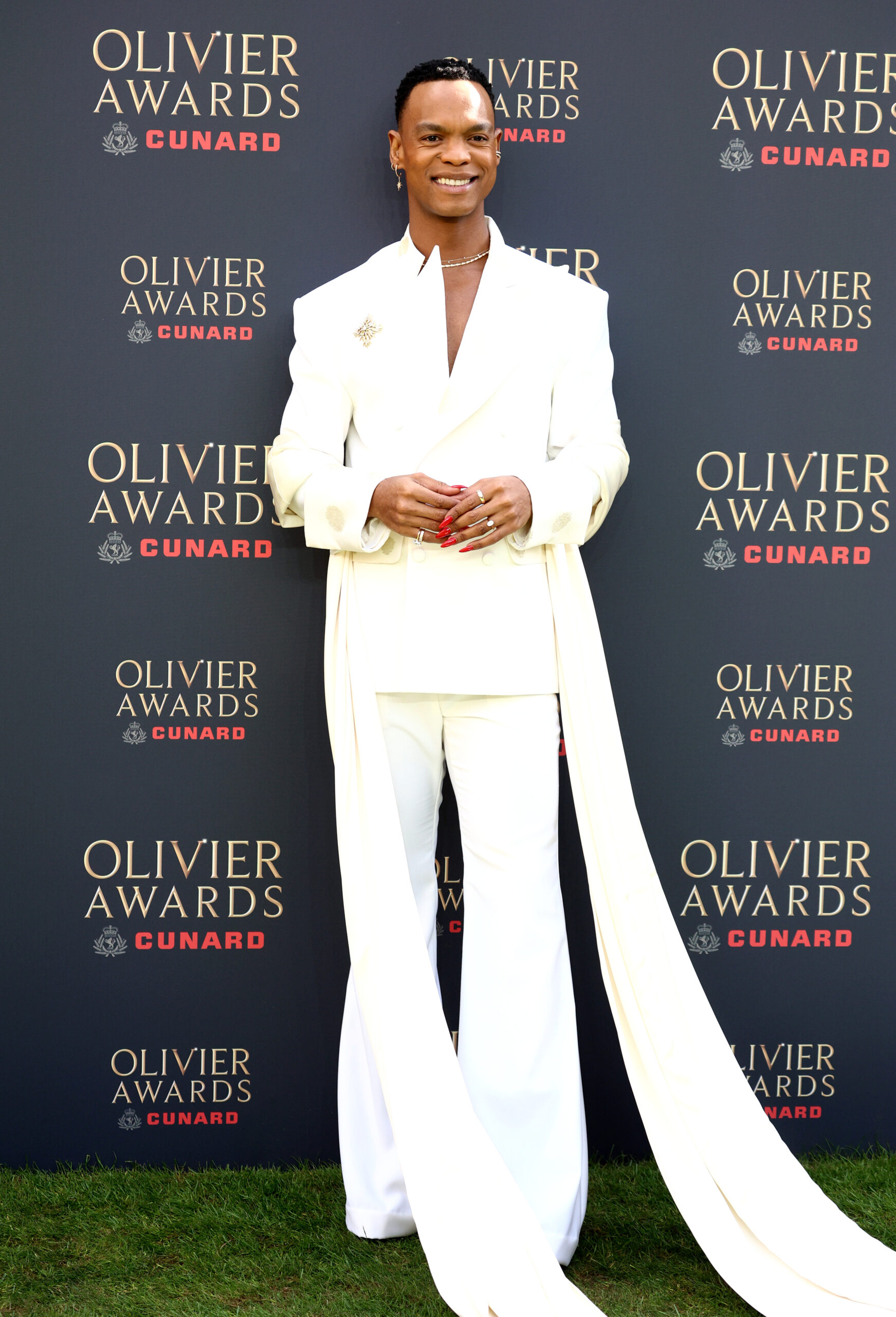 Johannes wearing a white suit at The Olivier Awards