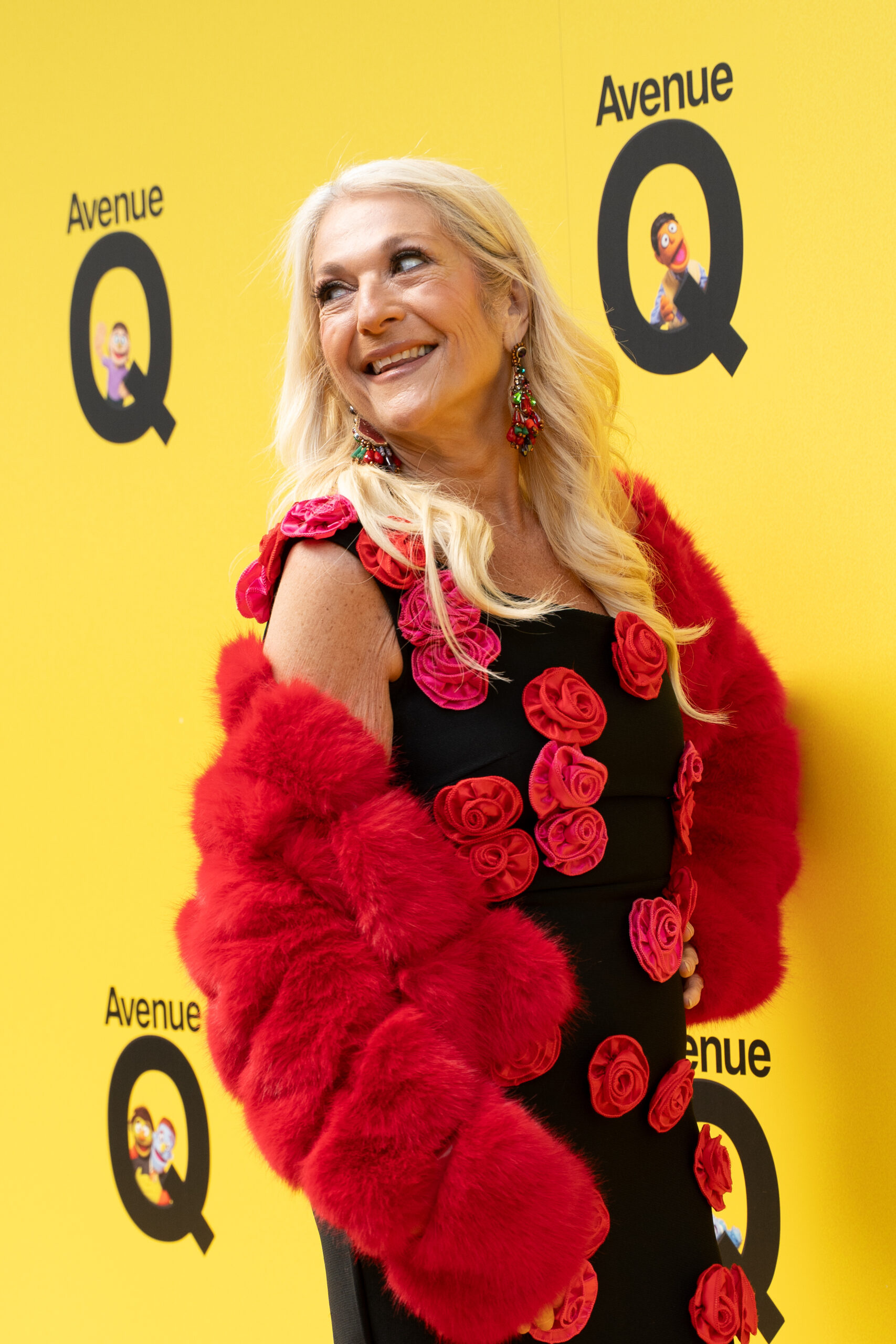 Vanessa Feltz smiling and looking over her shoulder