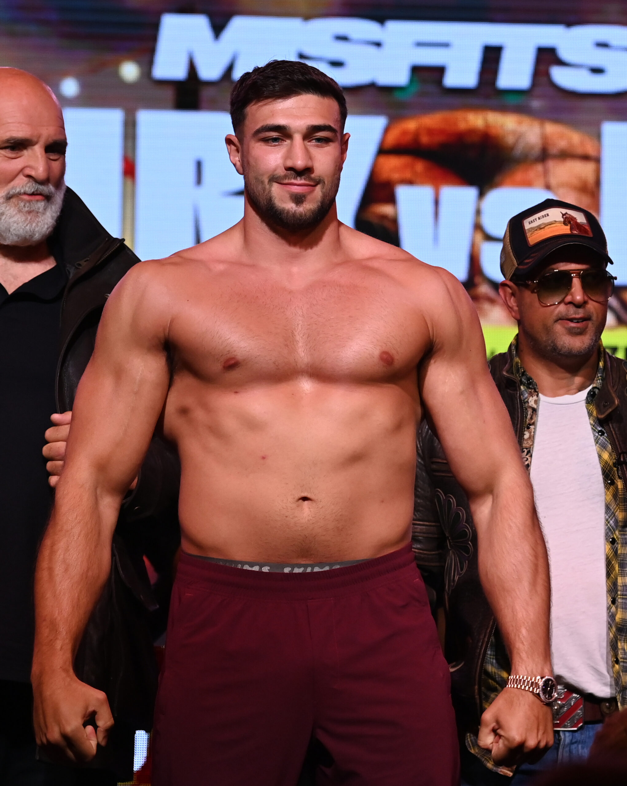Tommy Fury shirtless at boxing conference
