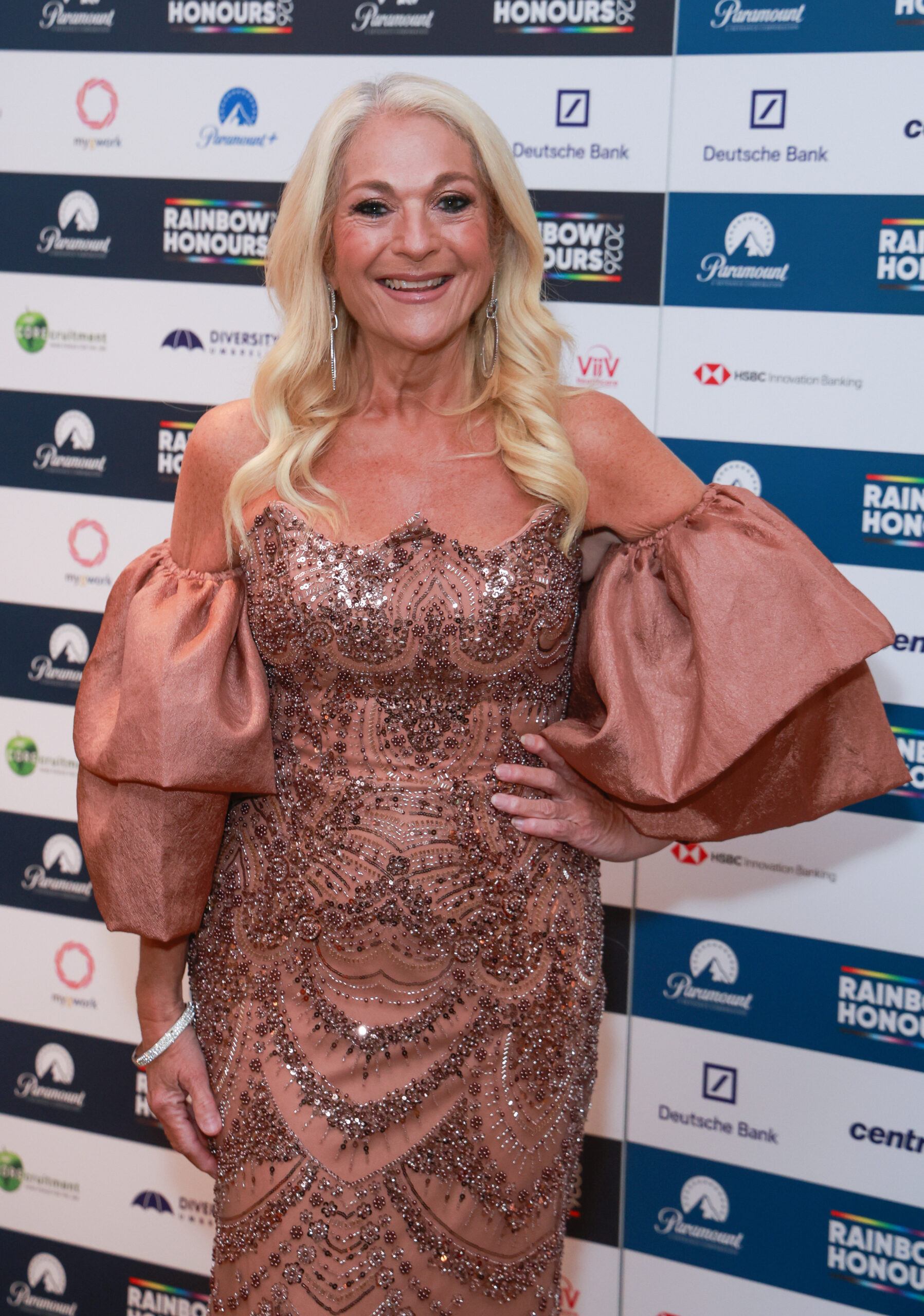 Vanessa Feltz smiling with her hand on her hip