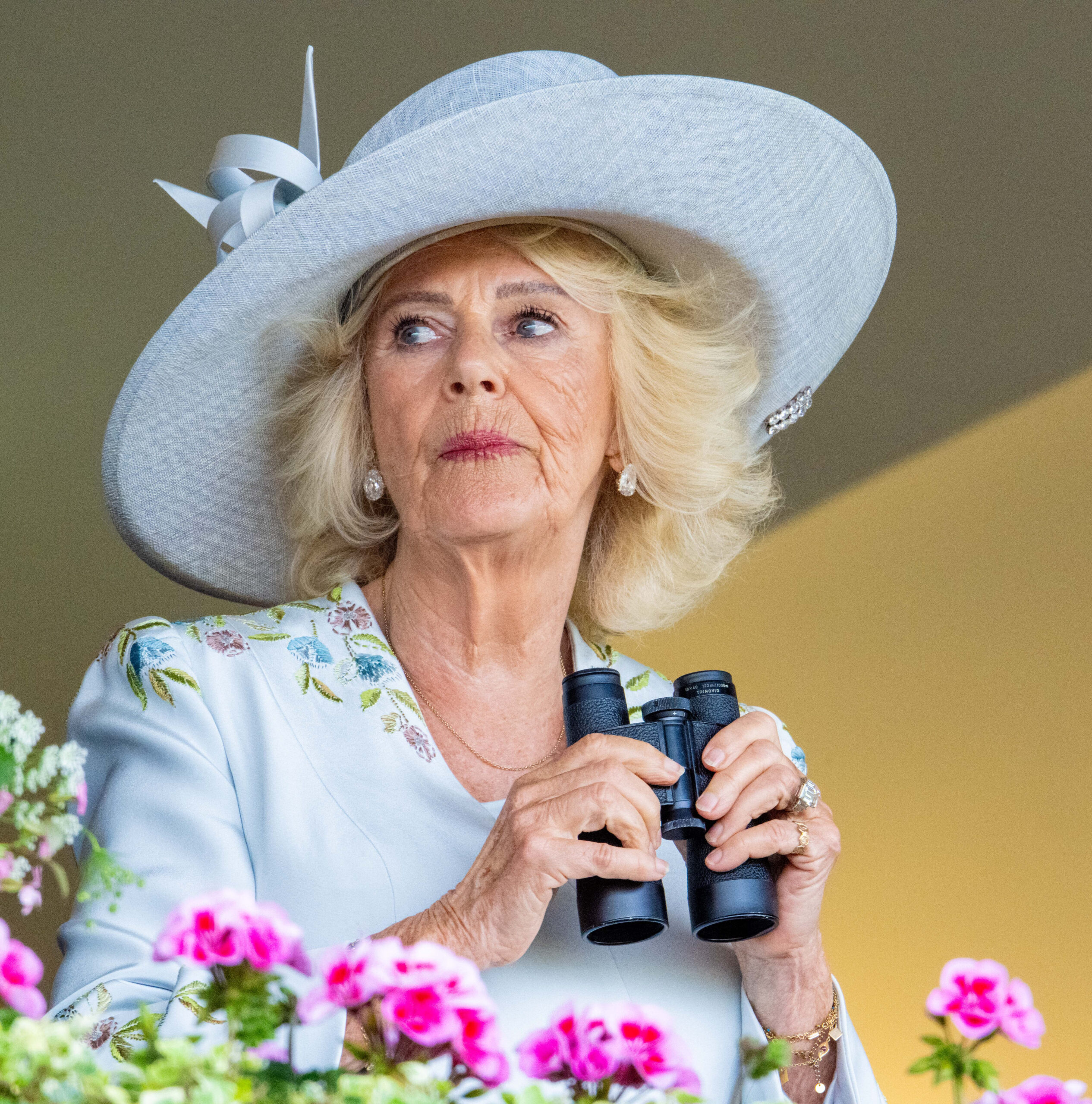 Queen Camilla holding binoculars