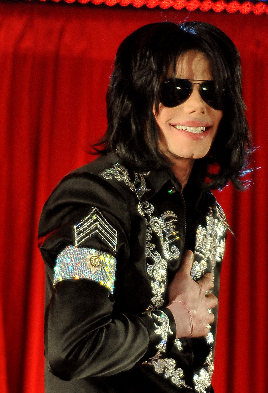 Michael Jackson smiling wearing sunglasses