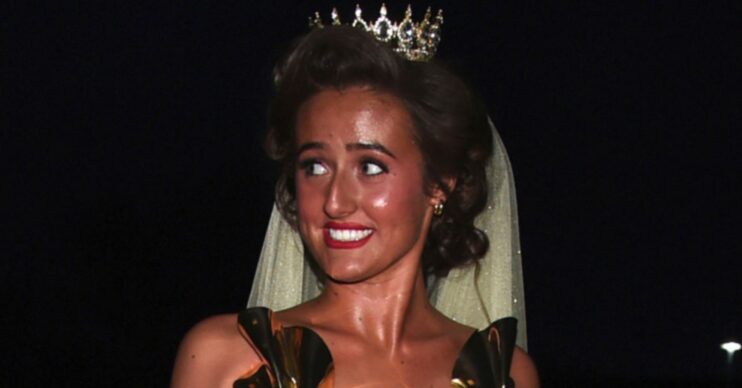 Venezuela Fury smiling, wearing a gold dress and a gold tiara