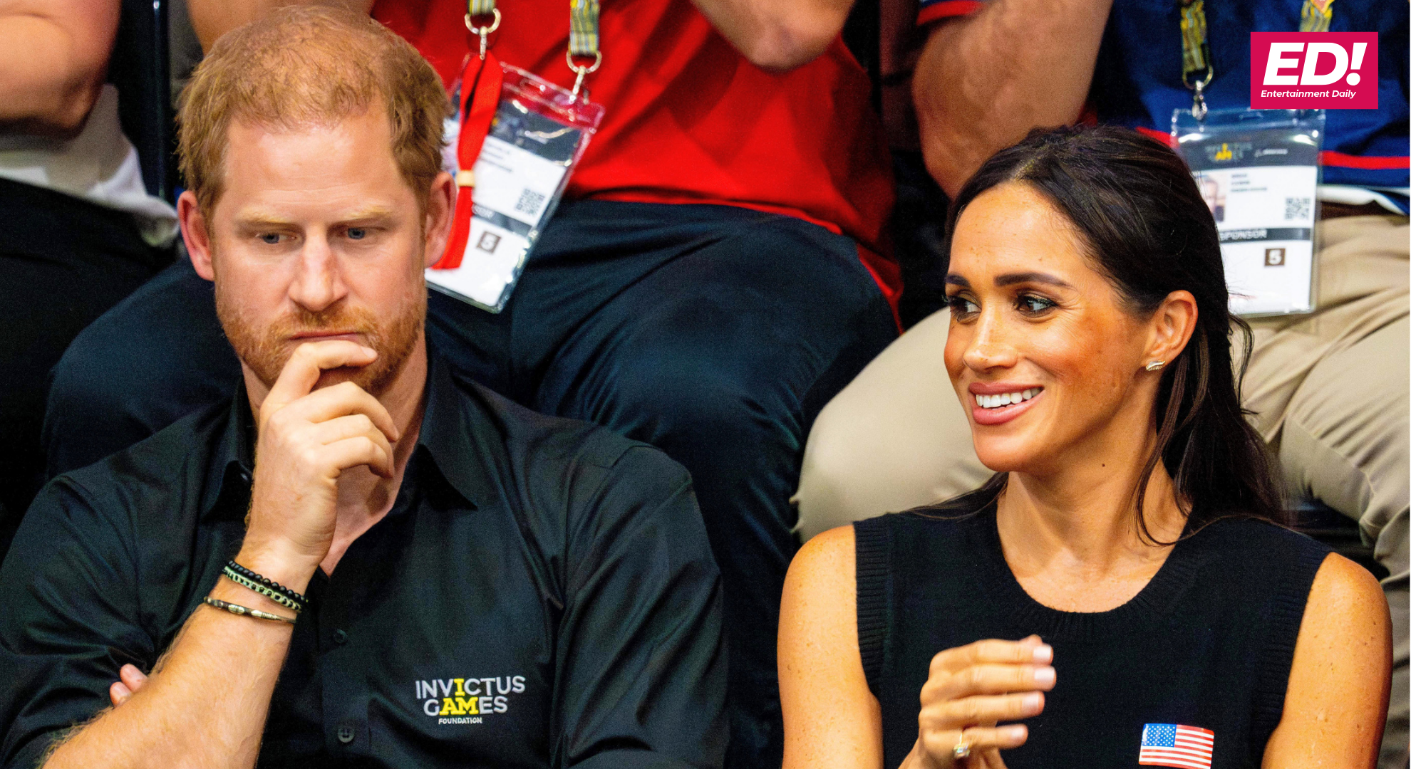 Harry frowning beside a smiling Meghan Markle