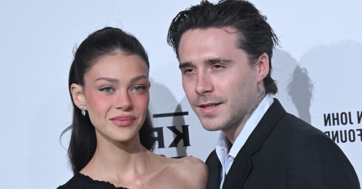 Nicola Peltz and Brooklyn Beckham posing together