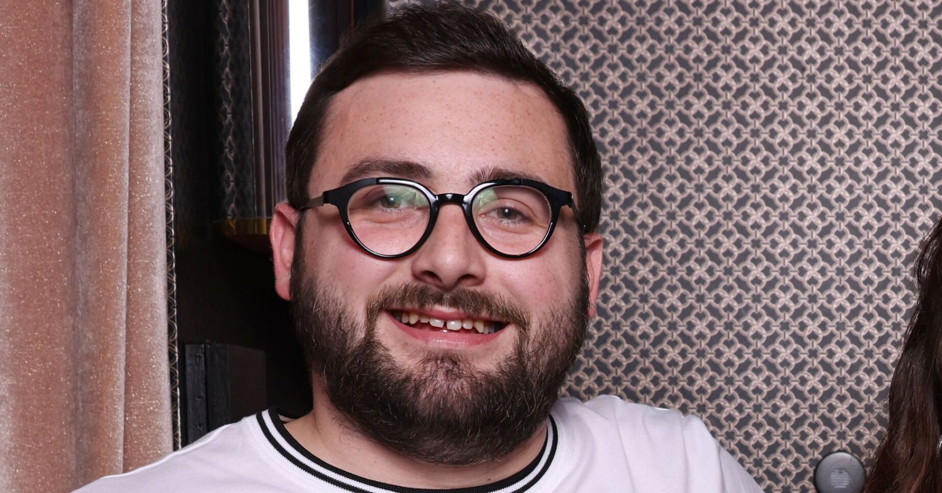 Shaun Malone smiling at event