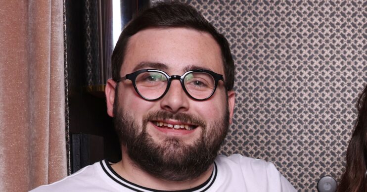 Shaun Malone smiling at event