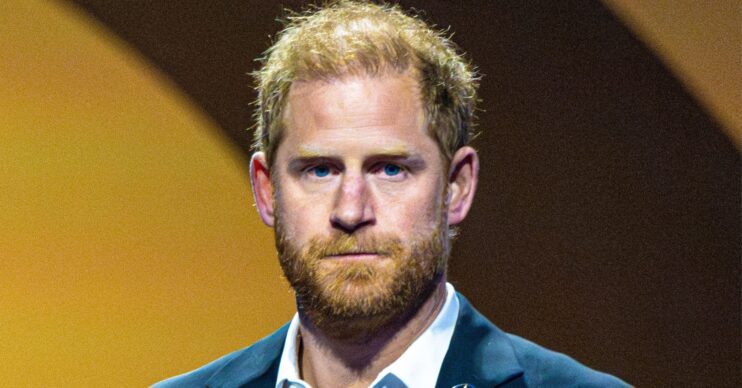 Prince Harry looking serious at event