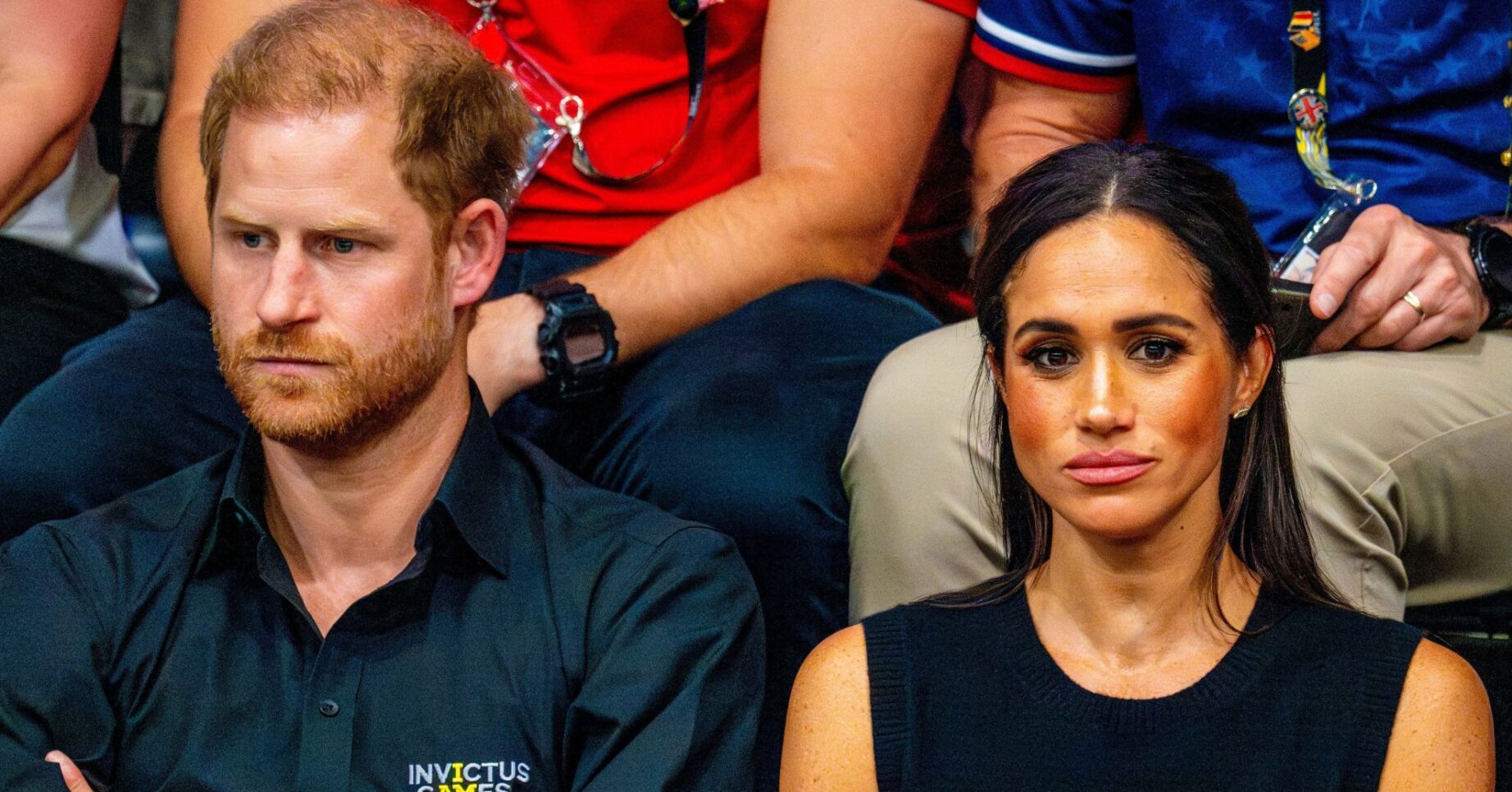 Harry and Meghan frowning