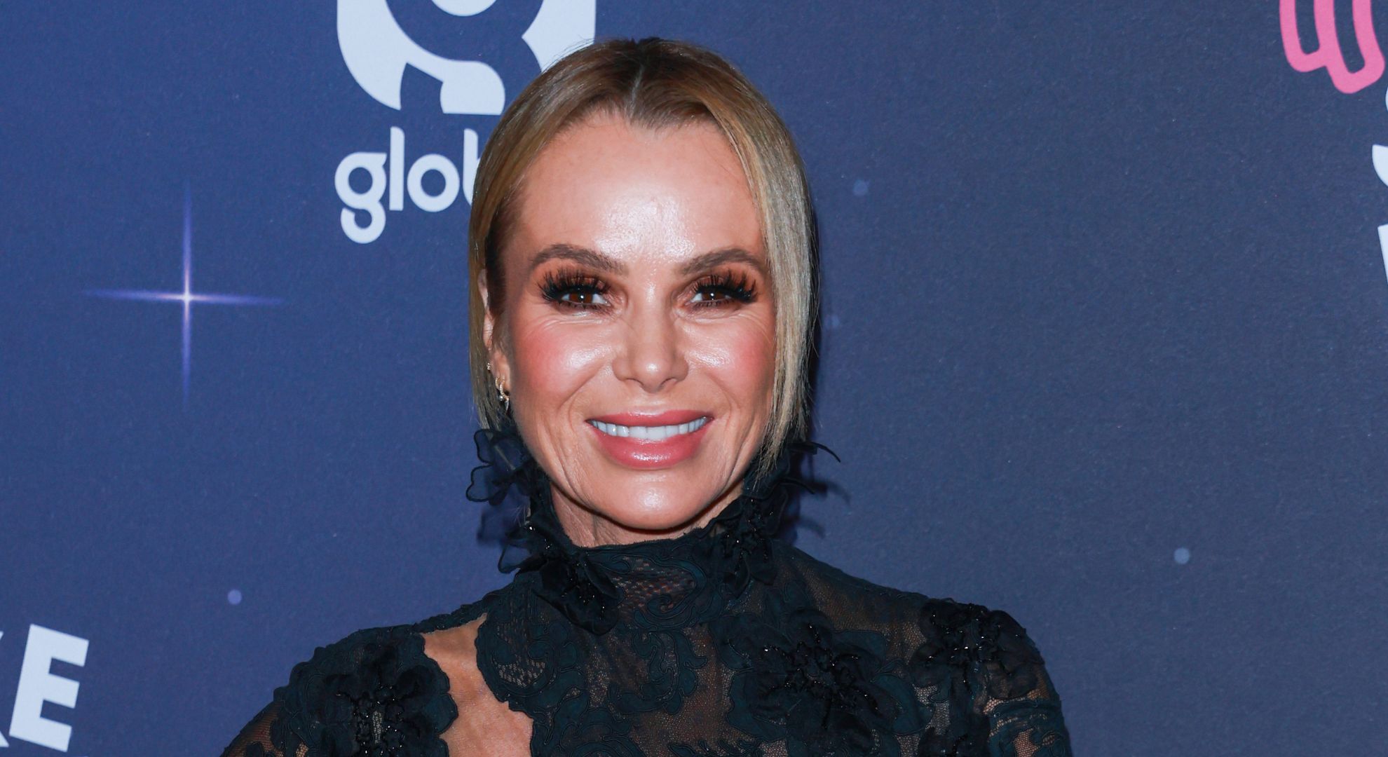 Amanda Holden stuns in tiny red bikini amid UK heatwave