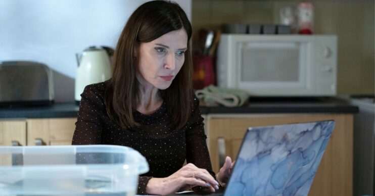 Bea on a computer in EastEnders