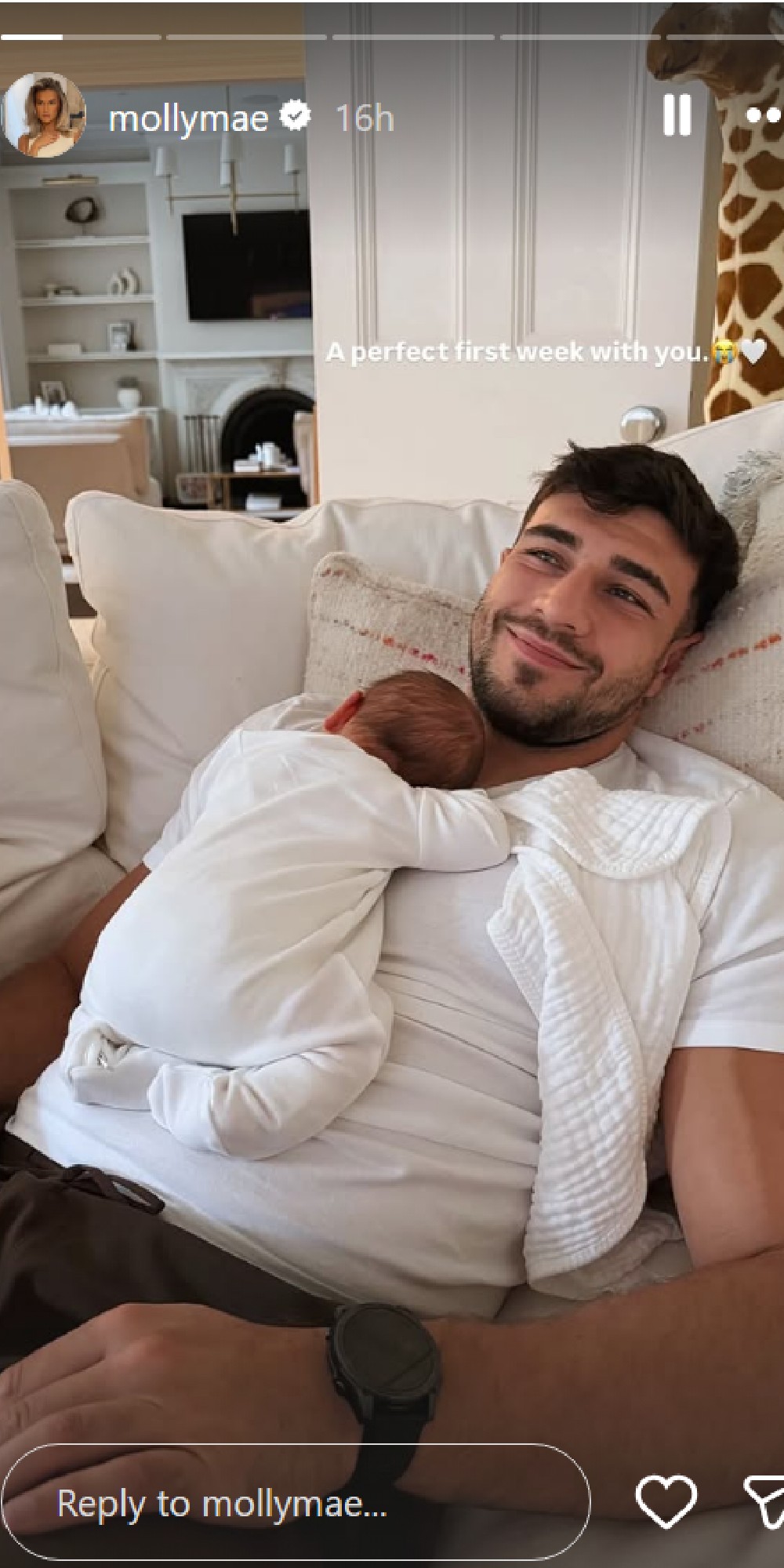 Tommy Fury with baby son on his chest