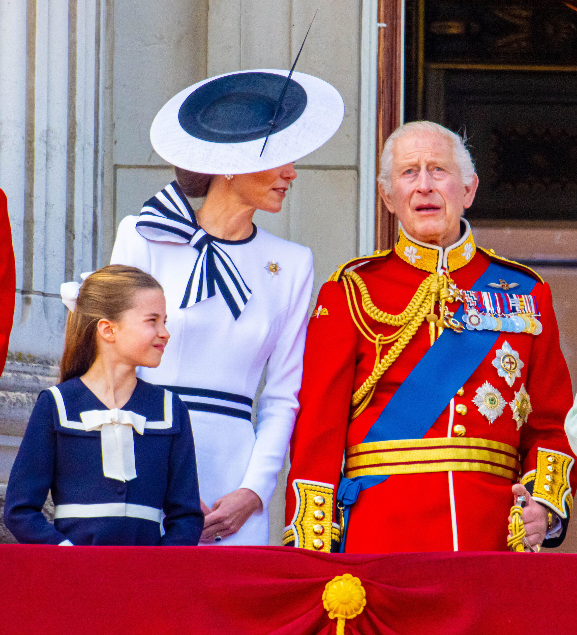 Kate Middleton speaking to King Charles on Buckingham Palace balcony